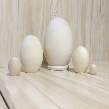 Набор из 5 неокрашенных заготовок деревянных матрешек в форме яйца для детей, расписывающих пасхальные яйца своими руками Изображение